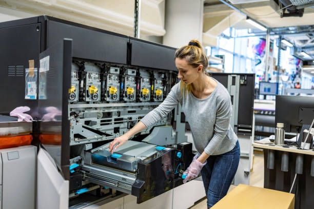 istock Woman working in a printing factory 2053182899