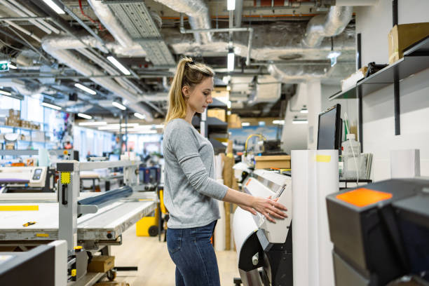 istock Woman working in a printing factory 2053183431
