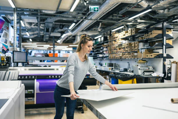istock Woman working in a printing factory 2053183438