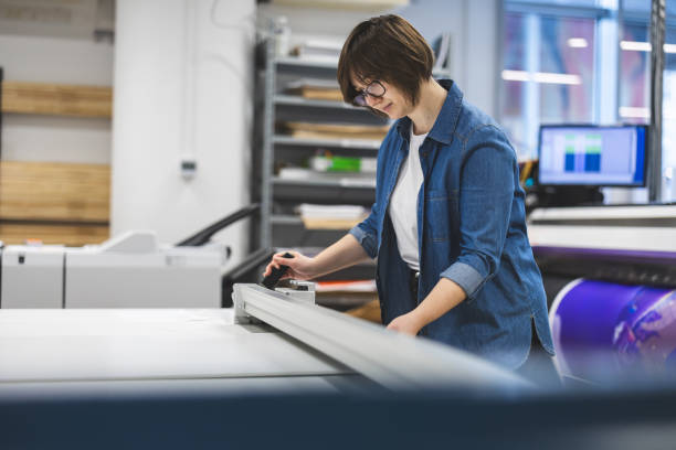 istock Woman working in a printing factory 2053183973