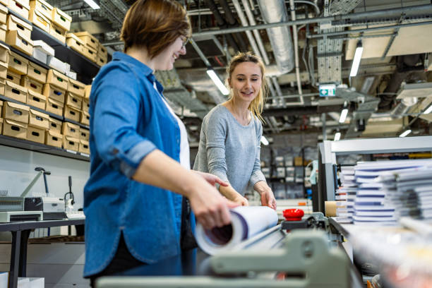 istock Professional female employees working in a printing house 2053183976