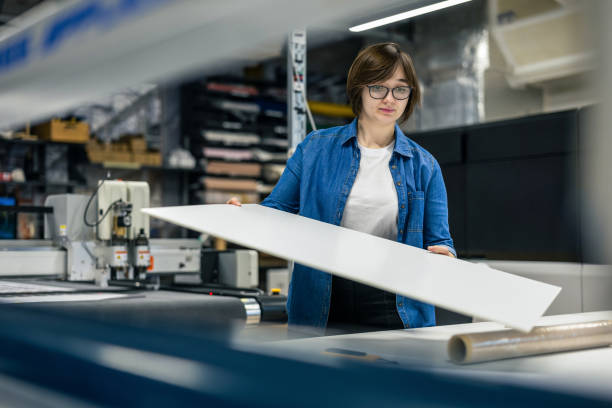 istock Woman working in a printing factory 2053183989