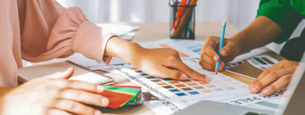 istock Interior designer discuss the color material with her colleagues. Variegated. 2053201113