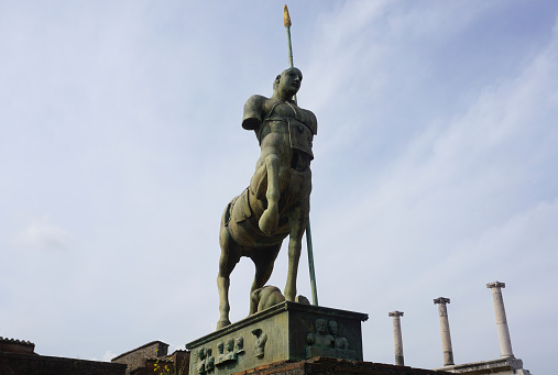Italy, Pompeii, June 14th, 2023. Metal monumental centaur statue in historic Pompeii