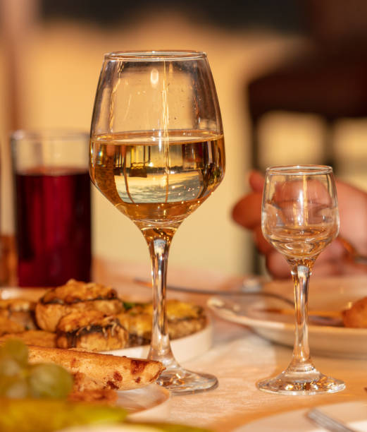 istock Glasses of white wine on the table ready for a romantic dinner 2053233159