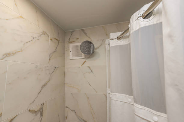 istock Hotel room with a ceiling-mounted showerhead and cloth curtains, blending stylish design with a cozy atmosphere. Miami Beach. USA. 2053237971