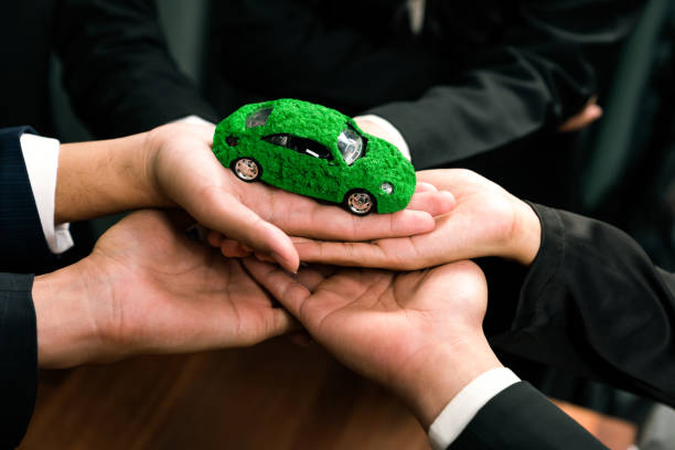 istock Business people synergy holding EV car model. Quaint 2053242176