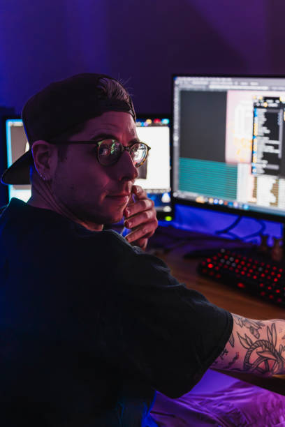 istock Attractive young man working in creative office Studio at home 2053251148