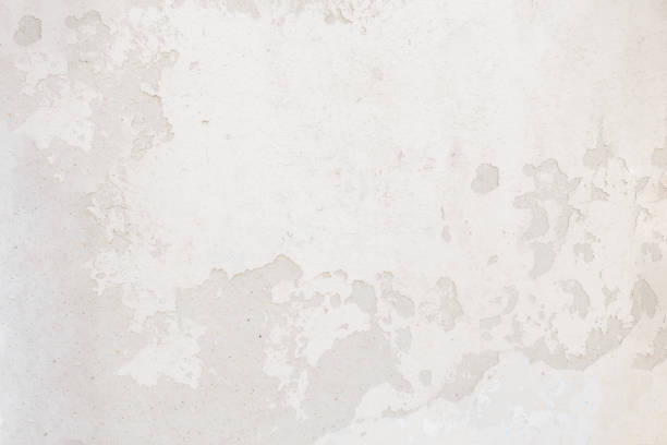 Vintage concrete texture with cracks and scratches. White wall
