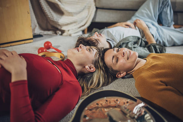 istock Friends relaxing on the floor 2053284166