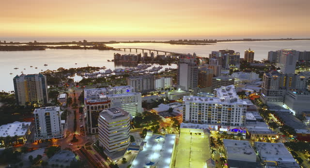 Sarasota, Florida city downtown at sunset with expensive waterfront high-rise buildings. Urban travel destination in the USA.