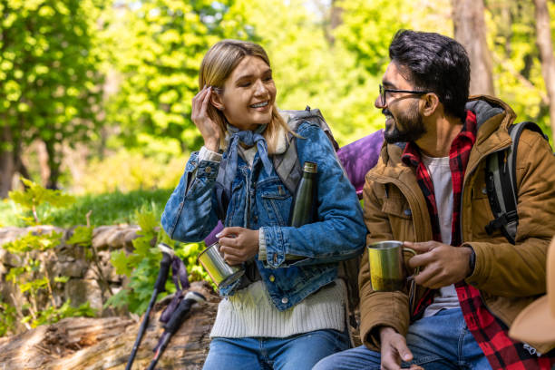 istock A man and a woman talking while having tea in the forest 2053289583