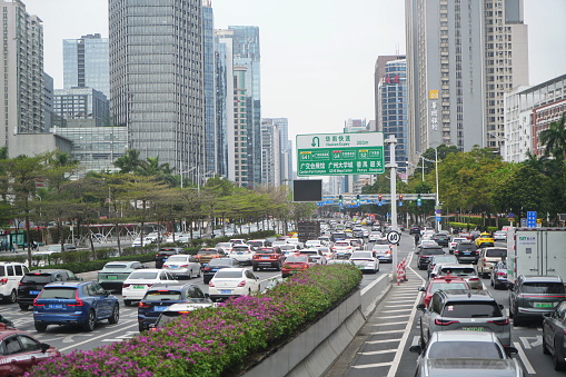 GUANGZHOU, CHINA - February  22, 2024: Heavy car traffic on the streets of the city centre