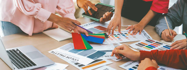 istock Interior designer discuss the color material with her colleagues. Variegated. 2053317930