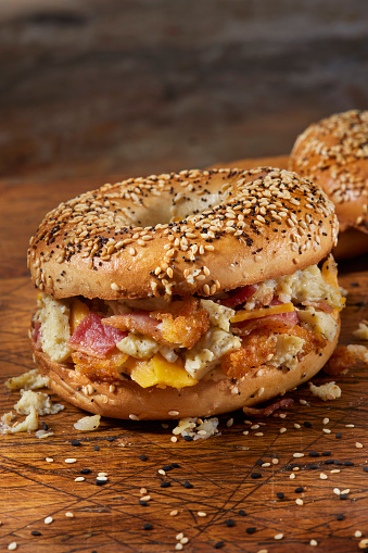 Copycat Chopped Everything  Bagel Breakfast Sandwich with Scrambled Eggs, Bacon, Cheddar Cheese and Crispy Hashbrowns