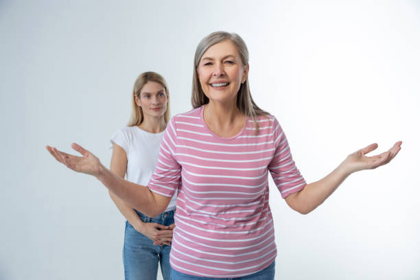 istock Two women on a studio photo smiling and looking confident 2053357668