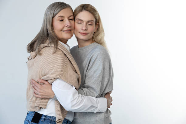istock Mother and daughter standing together and looking relaxed 2053359934