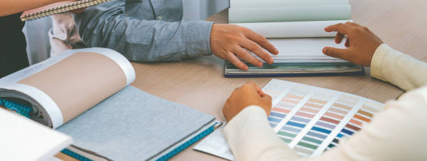 istock Architect and interior designer discussing about curtain material. Variegated. 2053363229