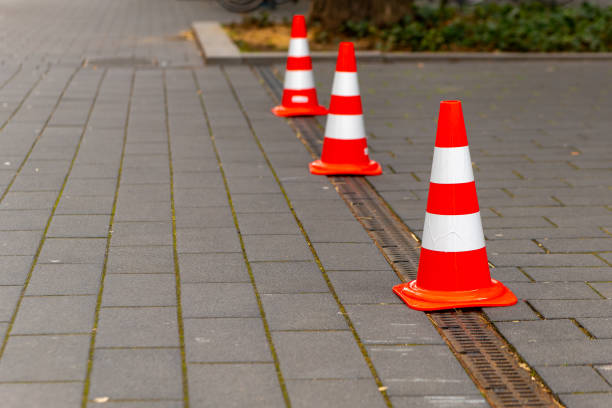 istock red and white road cones on a footpath 2053368498