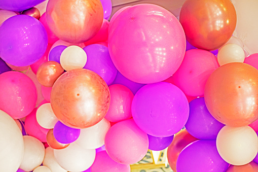 background of pink, purple and gold balloons. Grand opening children's party