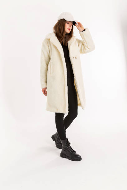 istock Brunette young woman wearing white coat and white hat. 2053385374