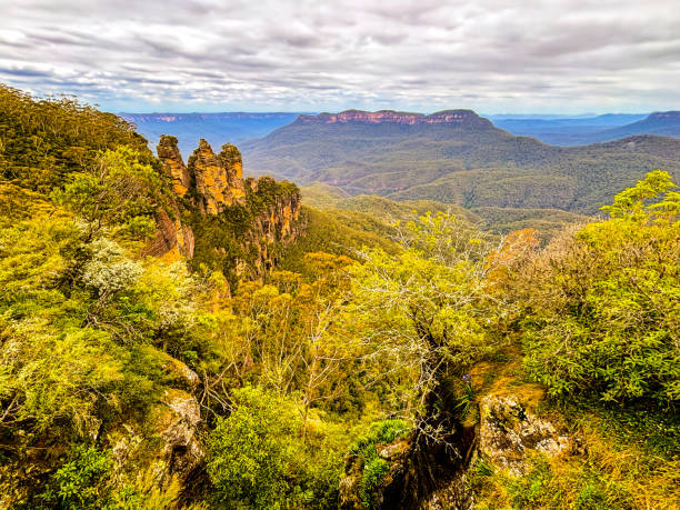 istock Wooded rocks with blue mountains in background in Australia 2053409110