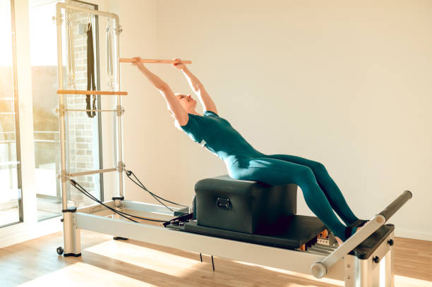 istock Woman has anaerobic workout session using Pilates machine in the gym 2053427431