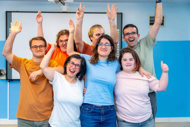 istock Happy people with special needs posing after gymnastic class 2053432659