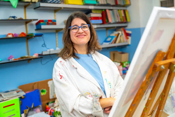 istock Satisfied disabled woman in the painting class 2053445696