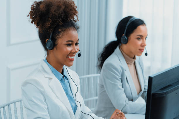 istock Business people wearing headset working in crucial office 2053455231