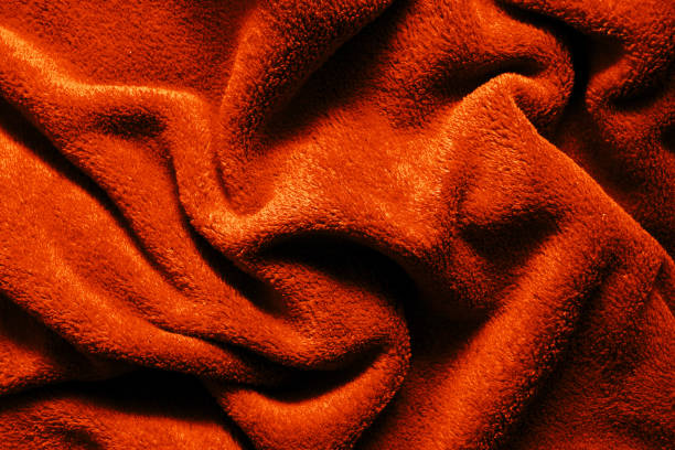 istock Yellow fabric background. Golden color blanket texture. Wave material pattern. Decorative curtain textile background. 2053455874