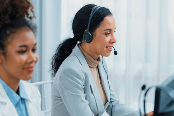 istock Business people wearing headset working in crucial office 2053460483