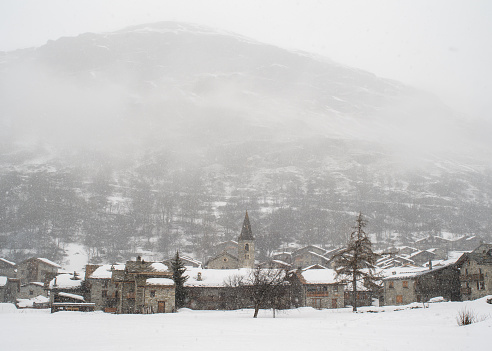 The village of Bonneval-sur-Arc in snowy gray weather