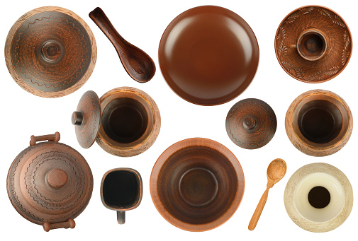 Variety of clay and ceramic products for cooking isolated on white background. Top view.