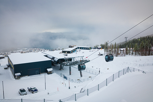 Ski Cooper, Colorado, USA- April 6, 2023: People on a ski lift at Ski Cooper ski resort, Colorado.