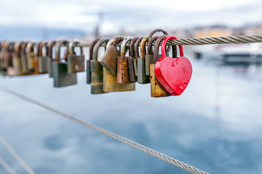 Love padlocks hanging on the wire in the port of Rijeka, Croatia