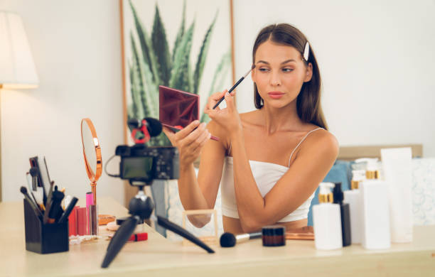 istock Young woman making beauty and cosmetic tutorial video content. Unveiling 2053571565