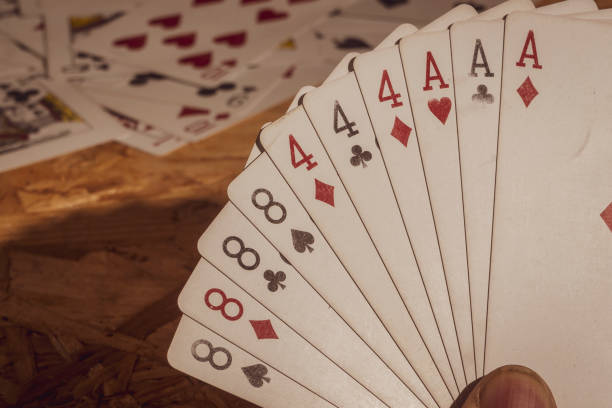 istock Card game or playing card on wooden table 2053586411