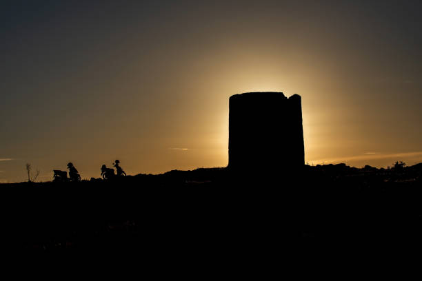 Bodrum windmill and motorcycles at sunset