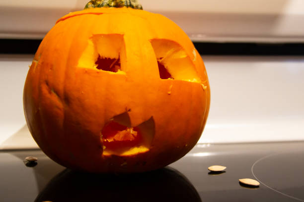 Scary Halloween pumpkin on an oven