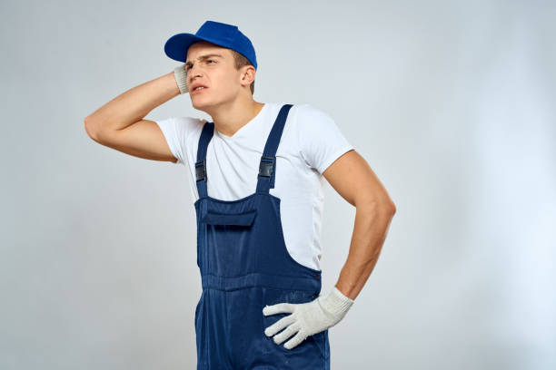 istock Man worker in forklift uniform delivery service light background 2053644406