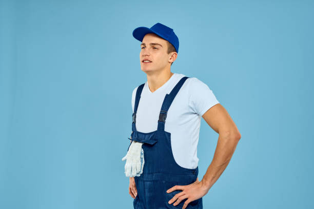 istock Working man in uniform of gloves loader rendering service blue background 2053644862