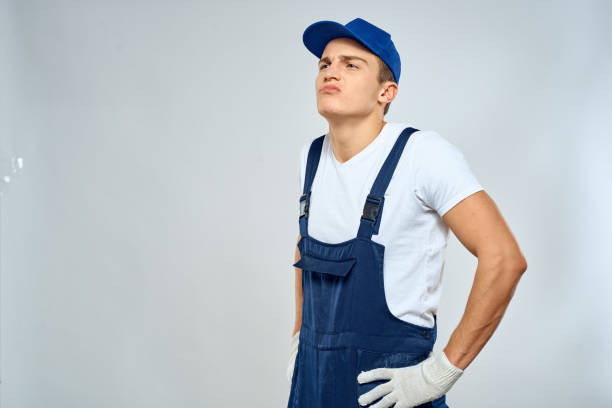istock Man worker in forklift uniform delivery service light background 2053646454