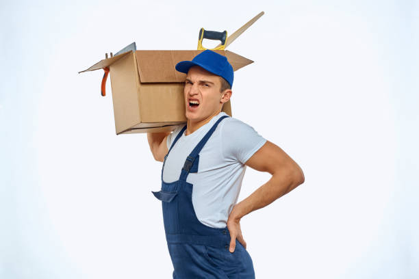 istock A man in a working uniform with a box in his hand loading a delivery service 2053646965