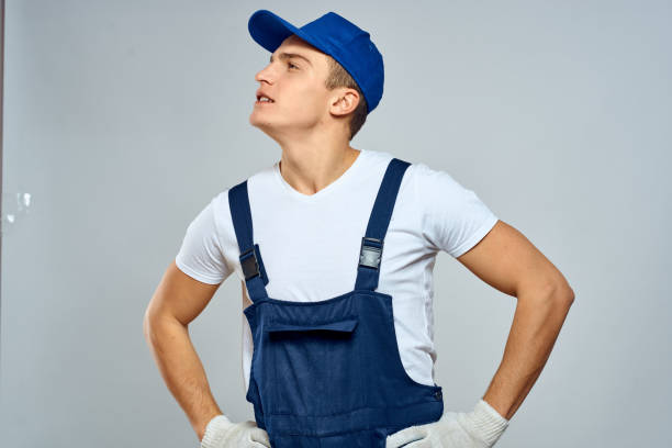istock Man worker in forklift uniform delivery service light background 2053647508