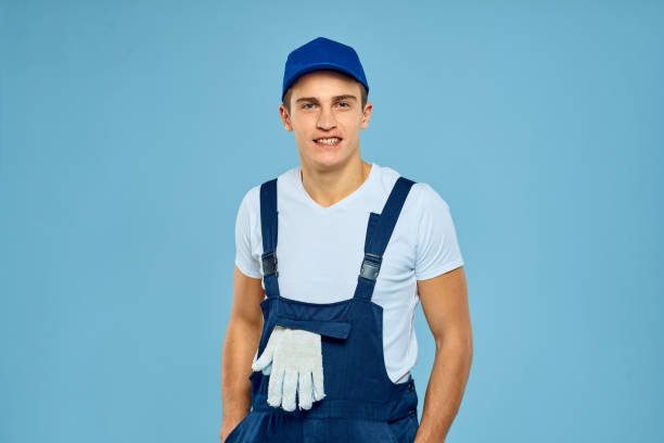 istock Working man in uniform of gloves loader rendering service blue background 2053659243