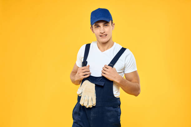 istock Man in working uniform emotions rendering service delivery service yellow background 2053659757