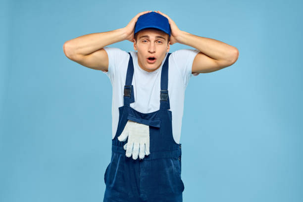istock Working man in uniform of gloves loader rendering service blue background 2053661280