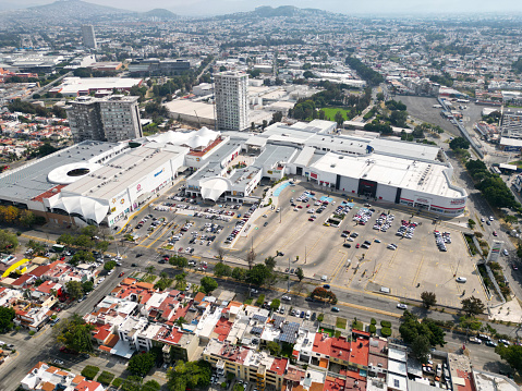 Overhead shot capturing the bustling Plaza Ciudadela in Guadalajara, with its expansive parking and unique architecture, Diagonal