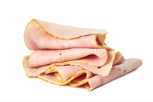Thin slices on ham isolated on white background